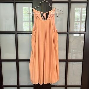 Pleated cocktail dress with high neck